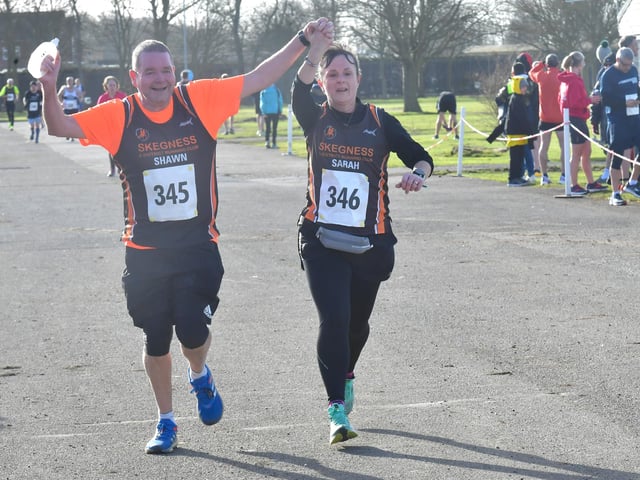 Runners celebrate finishing the 10K