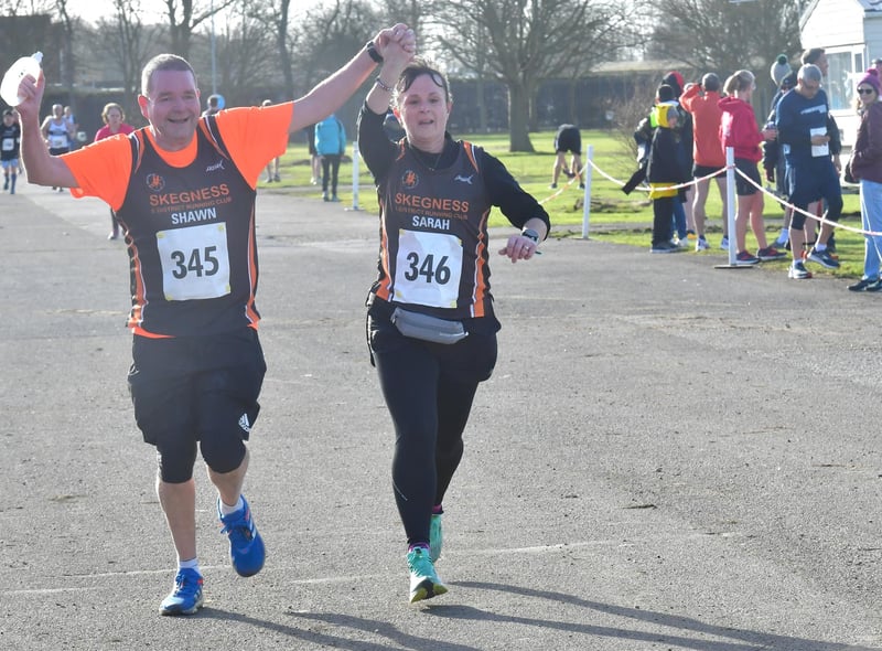 Runners celebrate finishing the 10K
