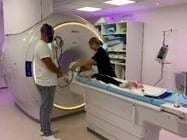 Radiographer Helen conducts the MRI scan on Phoebe.