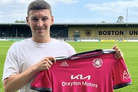 Alex Brown shows off Boston United's new pink away kit.