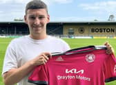 Alex Brown shows off Boston United's new pink away kit.