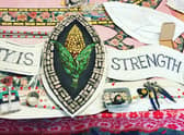 One of the finished small mosaic pieces that will be added to the large mural.