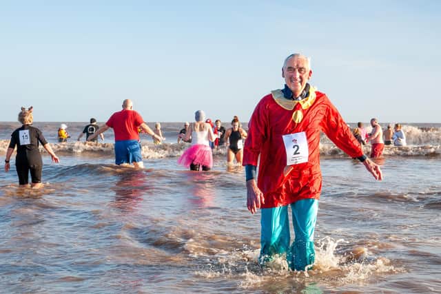 A waterlogged Malcolm Nix emerges from the surf on Mablethorpe Beach.