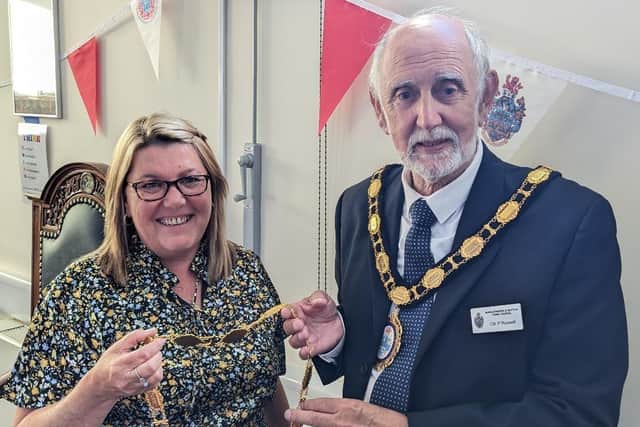 New Mablethorpe Mayor Coun Paul Russell handing over Deputy Chain to new Deputy Mayor Coun Claire Arnold. Photo: Carl Tebbutt