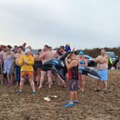 Participants in the ‘New Year North Sea Plunge ready to go in a variety of ensembles.