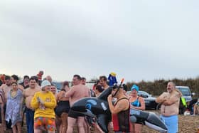 Participants in the ‘New Year North Sea Plunge ready to go in a variety of ensembles.