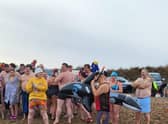 Participants in the ‘New Year North Sea Plunge ready to go in a variety of ensembles.