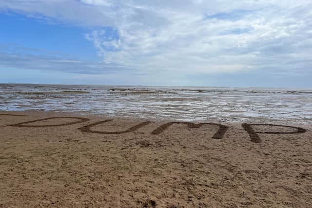 Part of the message carved in the sand for the King.