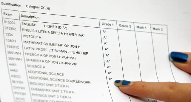 A close-up view of a piece of paper showing someone's GCSE results at Manchester High School for Girls.