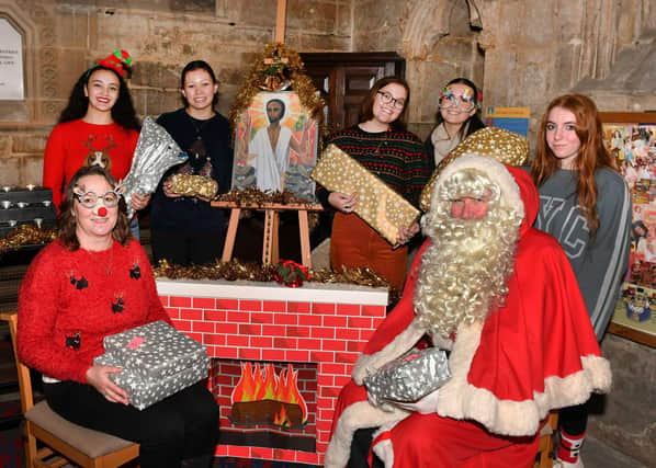 St Georges Academy students at St Denys' Church, from left - (front) Principal Laranya Caslin and Santa (back) Ranya Tran,  Katie Turner,  Ella Gibson,  Grace Simpson and Charlotte Whitelaw.