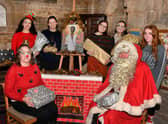 St Georges Academy students at St Denys' Church, from left - (front) Principal Laranya Caslin and Santa (back) Ranya Tran,  Katie Turner,  Ella Gibson,  Grace Simpson and Charlotte Whitelaw.