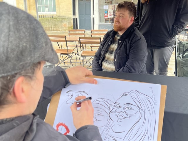 A caricature artist provided an added attraction. Photo: NKDC