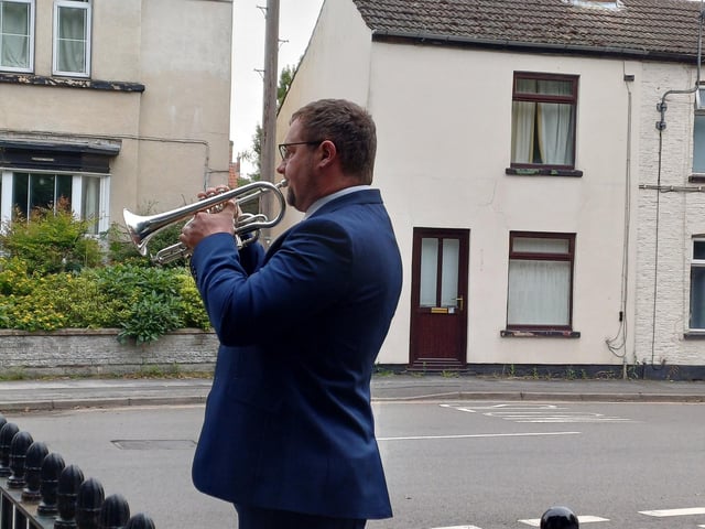 Bugler Rob Tinker played the Last Post and Reveille