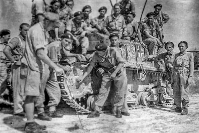 One of Captain Wincenty Tomaszewski's auctioned photos showing the Lancers with a captured German tank.