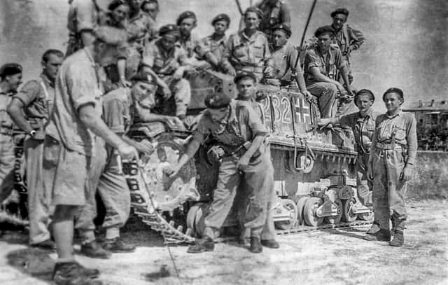 One of Captain Wincenty Tomaszewski's auctioned photos showing the Lancers with a captured German tank.