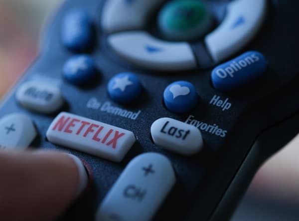 Netflix is launching the sub-account model soon, and a cheaper subscription package next month. Picture: Chris DELMAS/AFP via Getty Images.