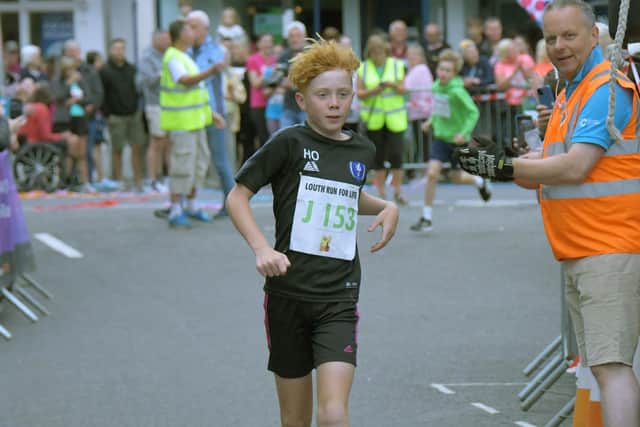 Harry Otty, 10, winner of th Under 12s race.