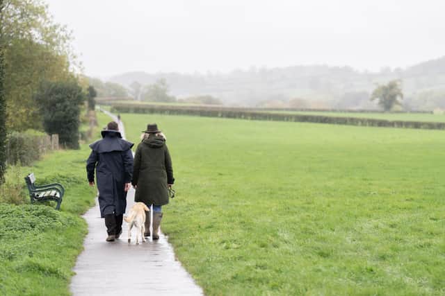 People walk on a footpath near Wells, Somerset. Picture date: Monday November 7, 2022.