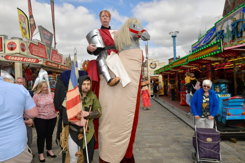 Medieval-themed street performers providing entertainment during Saturday's opening of Boston May Fair.