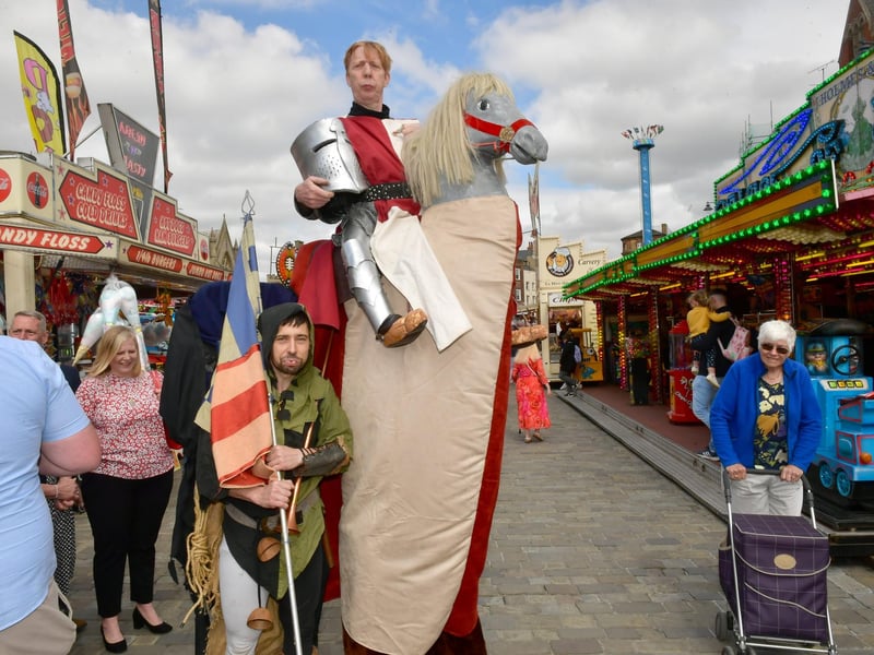 Medieval-themed street performers providing entertainment during Saturday's opening of Boston May Fair.