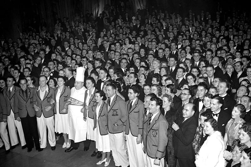 A crowd of holiday-makers, with a row of Redcoats at the front, at Butlin's holiday camp in 1938.