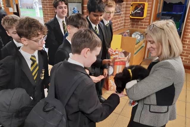 Florrie, getting some attention from pupils in the school's reception between classes.