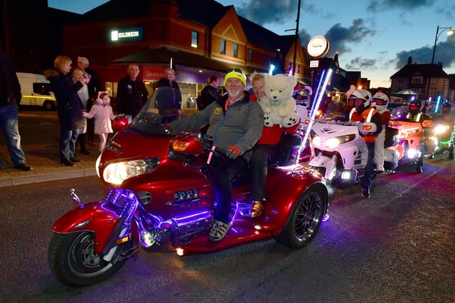 A bear gets a ride in the Skegness Light Parade