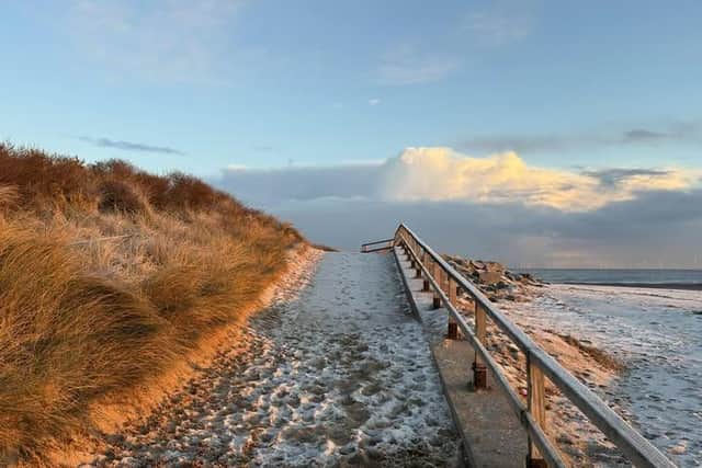 Calm before the storm - a beautiful picture of a winter walk in Skegness by John Byford.