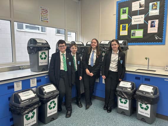 Eco-Committee members with the waste paper recycling bins (from left) Kayden Wylie, Harley Chancy, Paige Thomas and Sophie Gill.