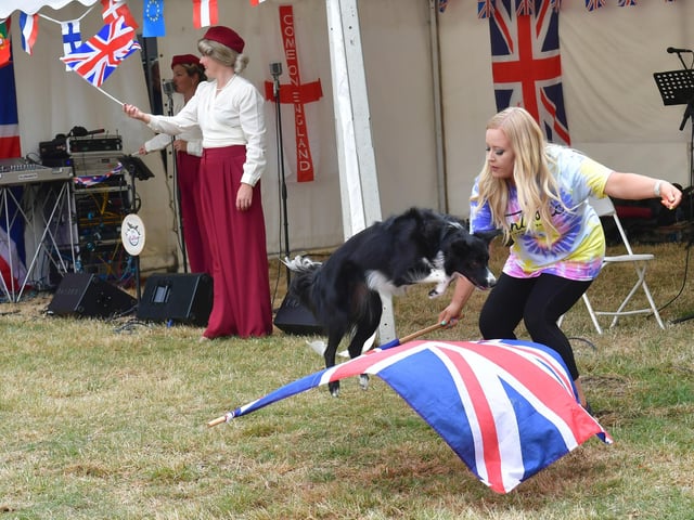 Lucy Heath with one of her dogs, performing a routine while Blighty Belles sing