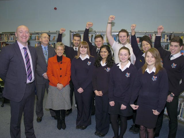 Boston High School celebrating the latest league table results. The Spilsby Road school was ranked third out of 55 ‘similar schools’ in terms of the proportion of pupils achieving at least five A*-C grades, including English and maths – with 99 per cent achieving that goal in 2013. Pictured with pupils (from left) are headteacher Andrew Fulbrook, assistant headteacher Nigel Guilliatt, and deputy headteacher Jackie Thornalley.