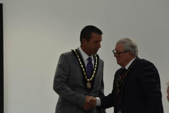 Coun Adrian Findley (left) is congratulated on becoming Deputy Mayor by new Mayor Coun Pete Barry. Photo: Barry Robinson.