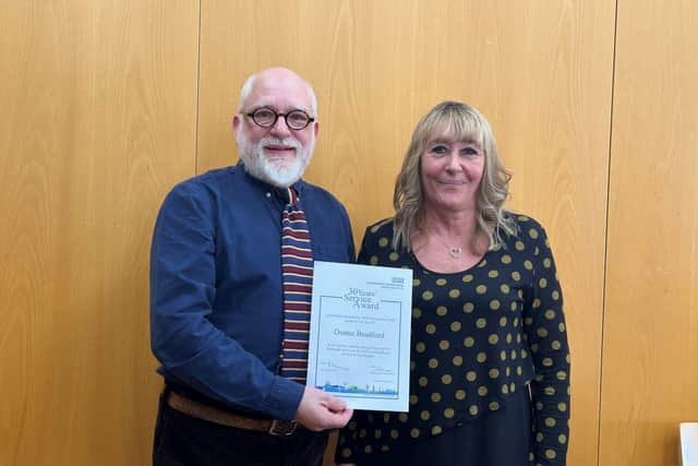 Donna Bradford receiving her Long Service Awards certificate at the celebration event