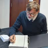 Coun Stephen Bunney was the first to sign the Book of Condolence