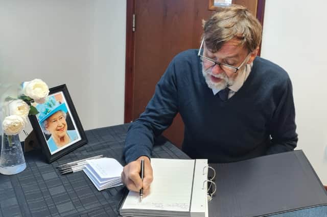 Coun Stephen Bunney was the first to sign the Book of Condolence