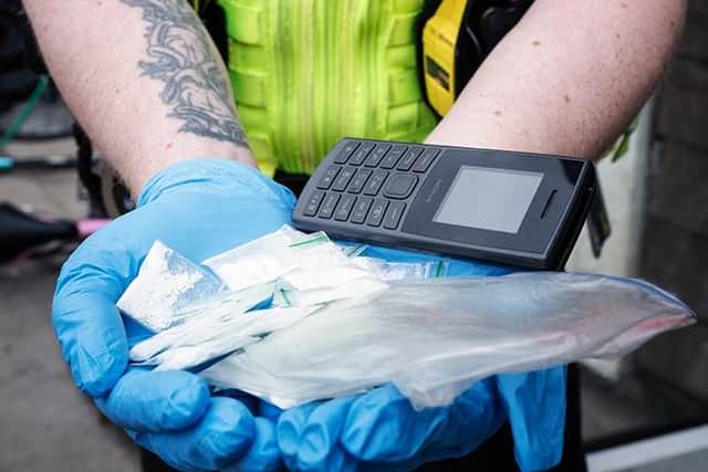drugs and a 'burner phone' among the items seized in the raid. Photo: Lincs Police