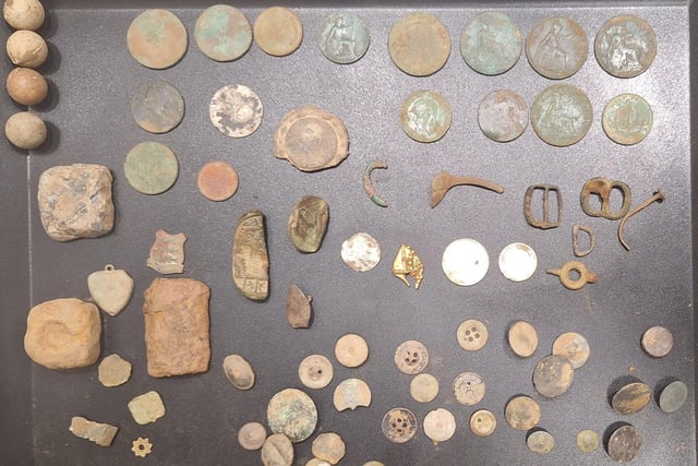 A tray of artifacts found during the 3 day metal detecting session in Quadring - with the gold relic (centre).