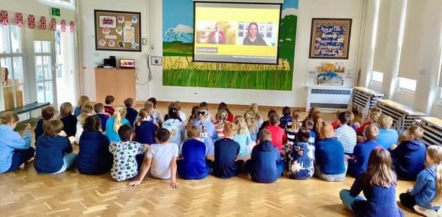 Children at Donington on Bain Primary School take part in a national VE Day assembly.
