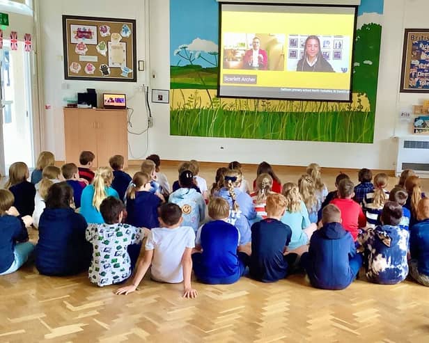Children at Donington on Bain Primary School take part in a national VE Day assembly.