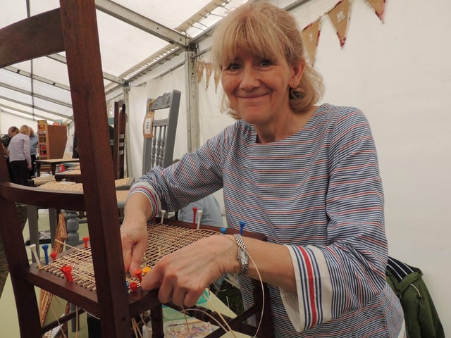 Louise Boulton, of Leasingham, demonstrating her hobby of cane chair seating.