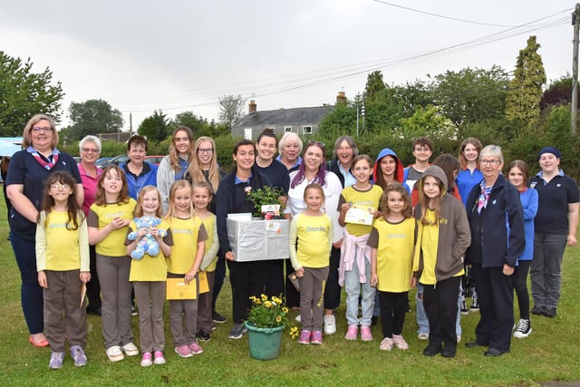 All the members present for Gold awards to Guide Evie Kerry and Gold award to Sylvia Dring from the Brownies. Image: John Edwards