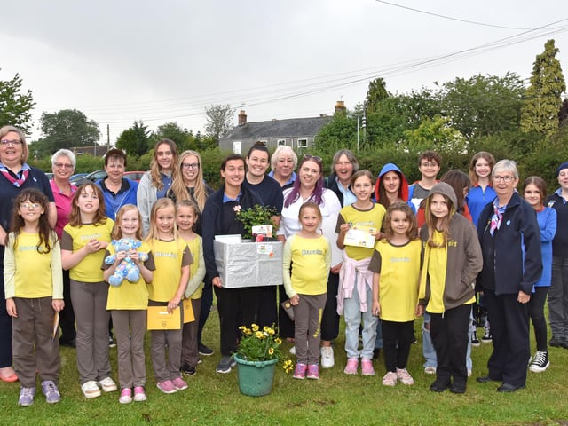 All the members present for Gold awards to Guide Evie Kerry and Gold award to Sylvia Dring from the Brownies. Image: John Edwards
