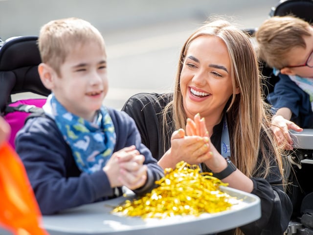 Staff and pupils cheered on the official opening of their new school.