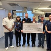 Lyn with family and friends making donation to staff at Intensive Care Unit, Pilgrim Hospital, Boston.