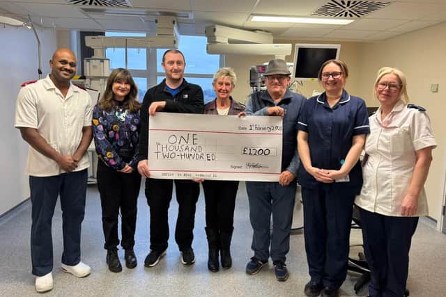 Lyn with family and friends making donation to staff at Intensive Care Unit, Pilgrim Hospital, Boston.
