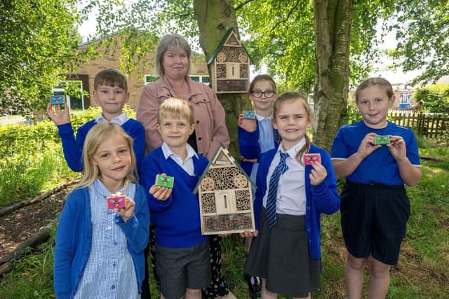 The school’s Green Team is pictured holding the donated items from Bellway, which they will plant in the Early Years garden.