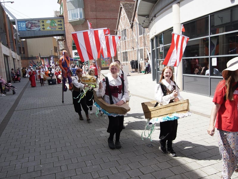 The parade featured ship costumes, created by Rhubarb Theatre in collaboration with Boston High School, in a nod to Boston’s maritime heritage. Youngsters from the school wore the costumes on the day.