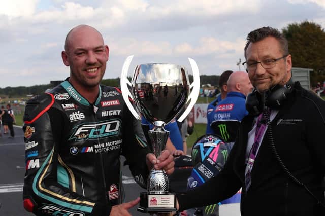 Peter Hickman with race director Stuart Higgs and his trophy for second place. Photo: Dave Yeomans