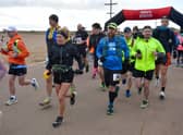 Runners at the start head off down the promenade in Skegness.