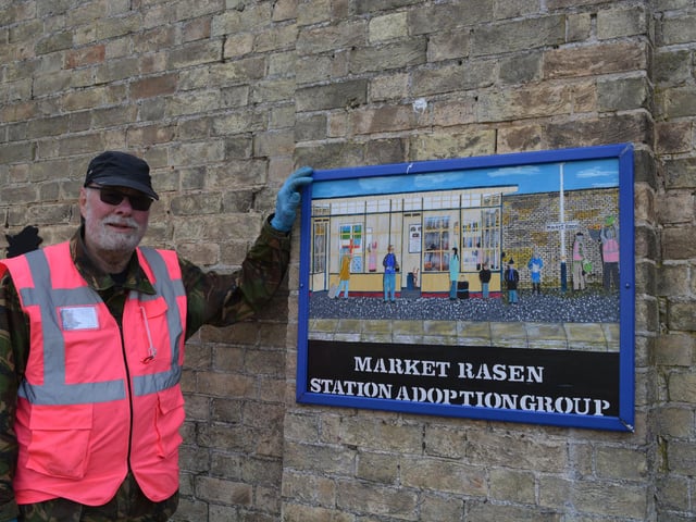 Chairman John Pope with the new sign